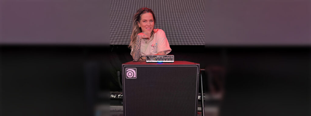 Moa Munoz standing behind and leaning on a Venture head and cab